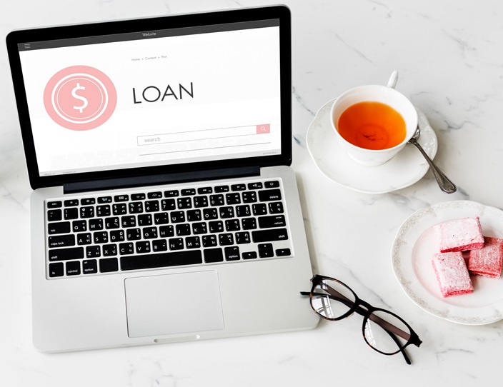 Laptop screen with the word "LOAN".